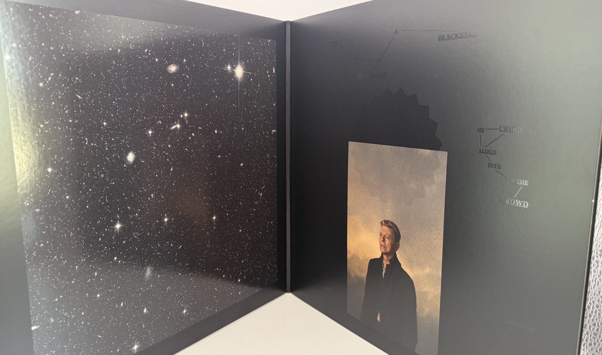 David Bowie Blackstar booklet star field and portrait artwork