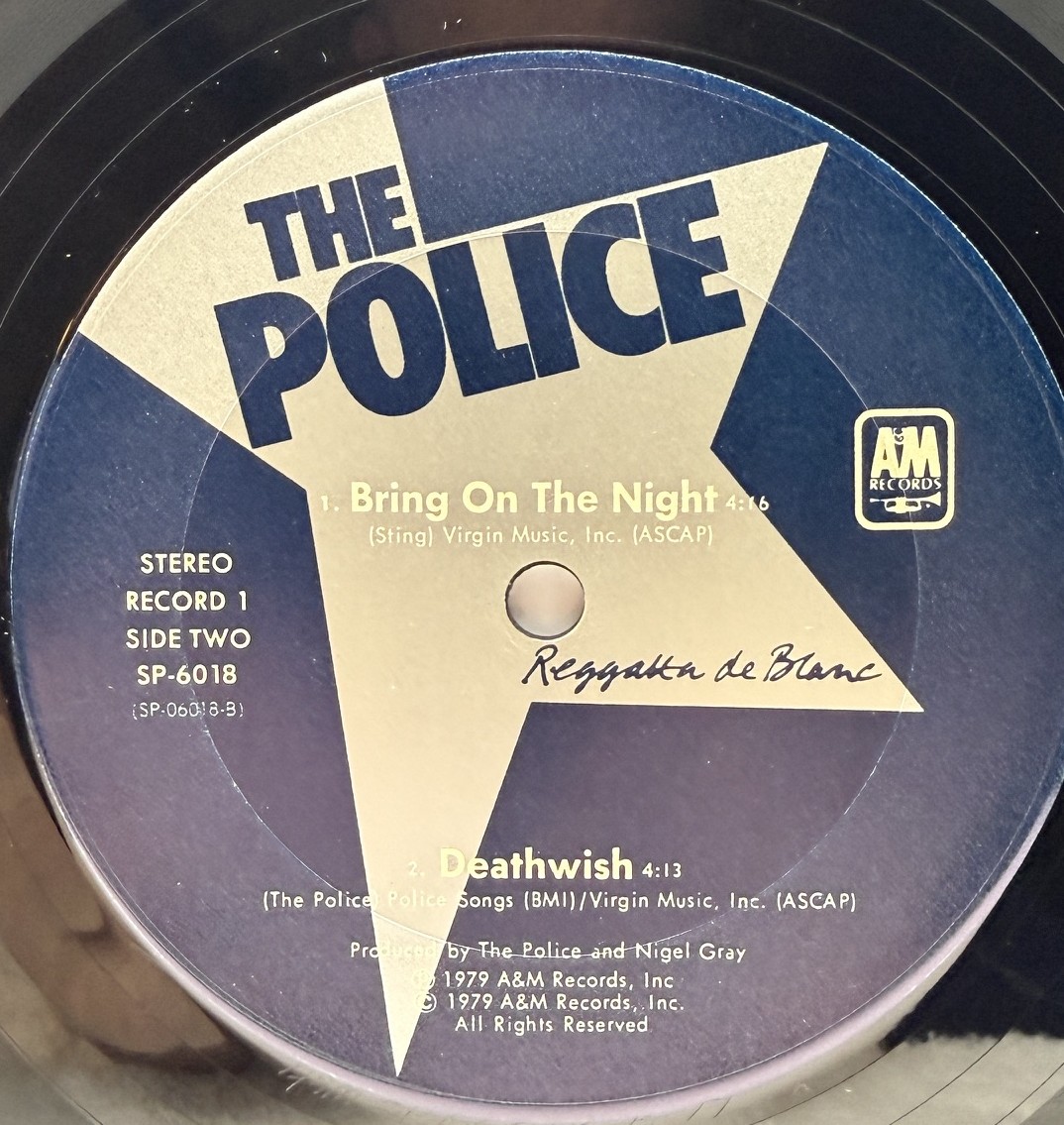 The Police Reggatta de Blanc record one side two label