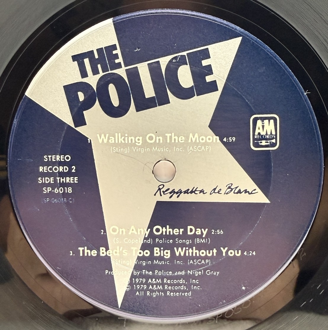 The Police Reggatta de Blanc record two side three label