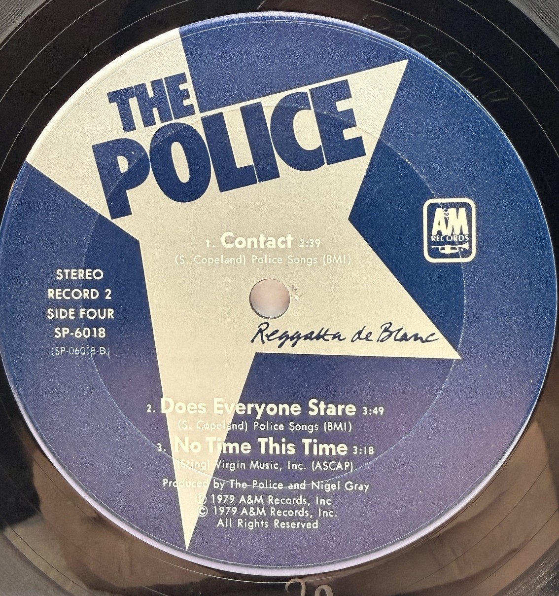 The Police Reggatta de Blanc record two side four label