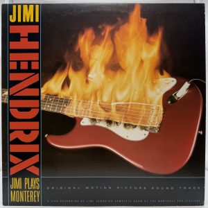 Front cover: Jimi Hendrix Jimi Plays Monterey 1986 vinyl soundtrack front cover with flaming guitar artwork